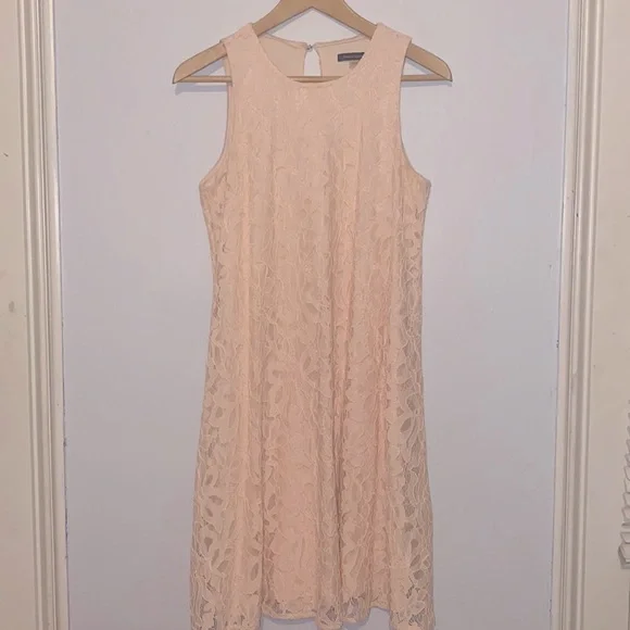 Blush pink lace dress with peek-a-boo back detail Blush pink lace dress with peek-a-boo back detail